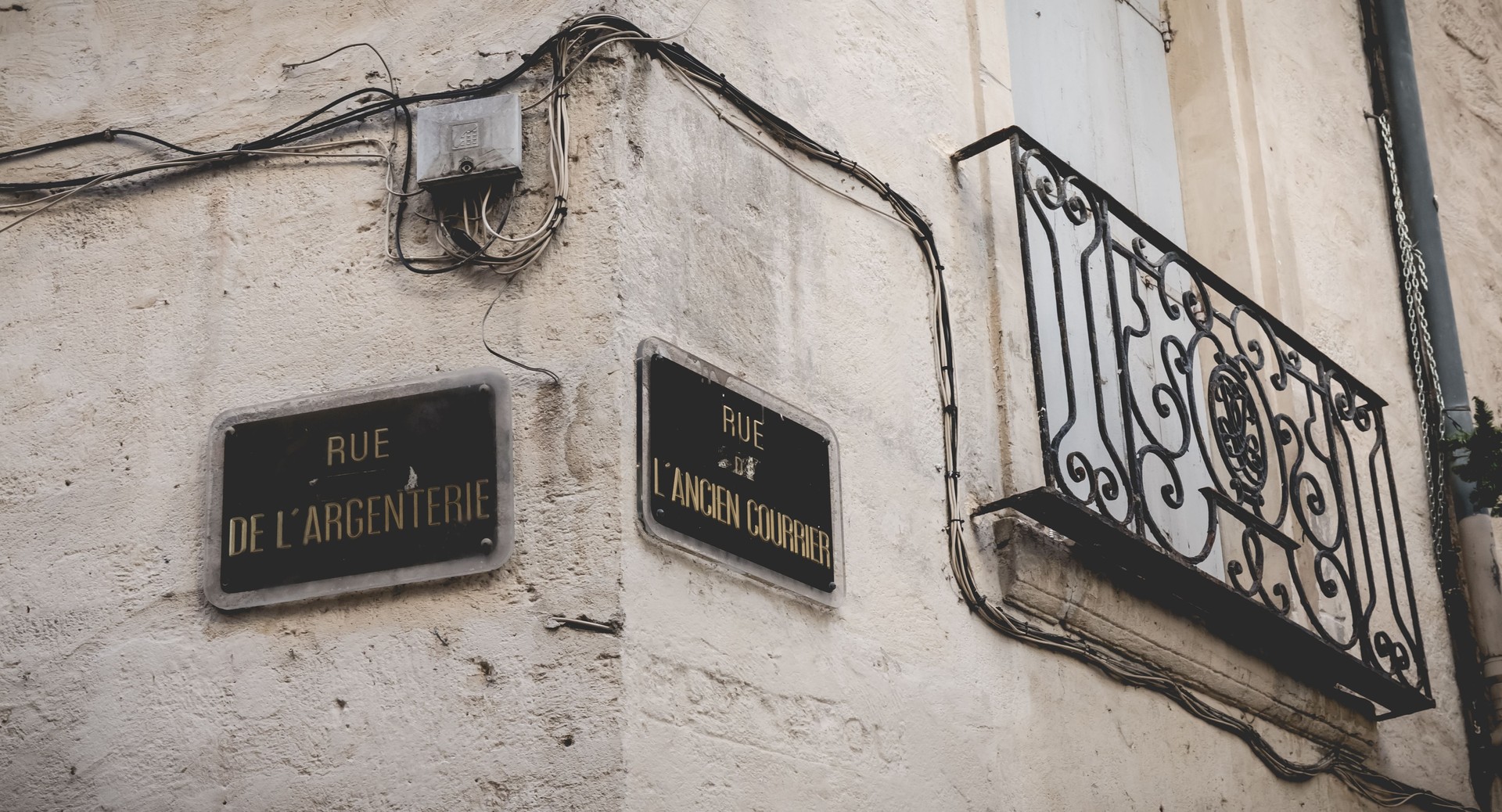 Street name plate in French - Rue de Argenterie and Rue de Ancien Courier in Montpellier